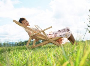 Young Woman Sleeping on Lawn Chair
