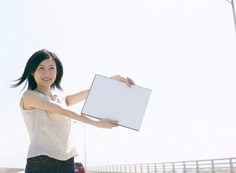 Woman Standing Beside the Road